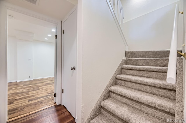 1304 Ceres Dr, Lafayette, CO 80026 - stairs featuring wood finished floors and recessed lighting