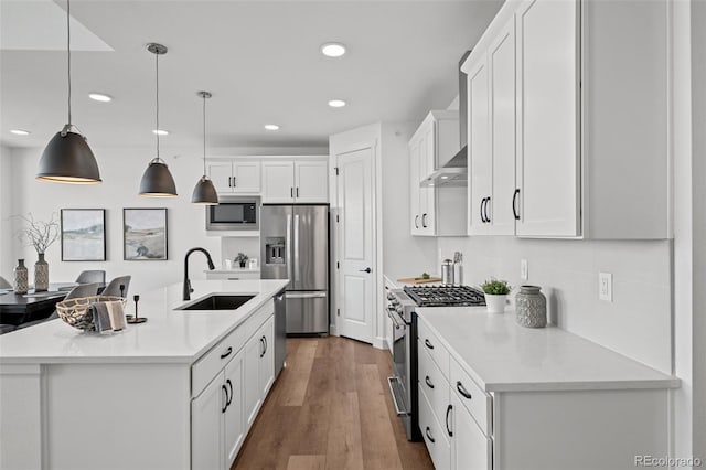 8242 S Pierson St, Littleton, CO 80127 - kitchen featuring decorative light fixtures, a sink, light countertops, white cabinets, and appliances with stainless steel finishes