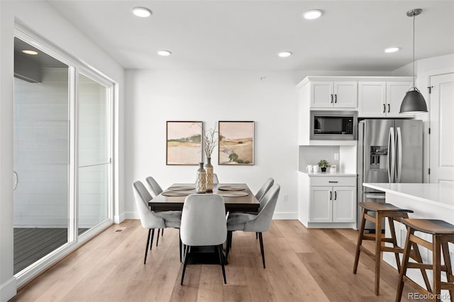 8242 S Pierson St, Littleton, CO 80127 - dining space with light wood-type flooring, baseboards, and recessed lighting