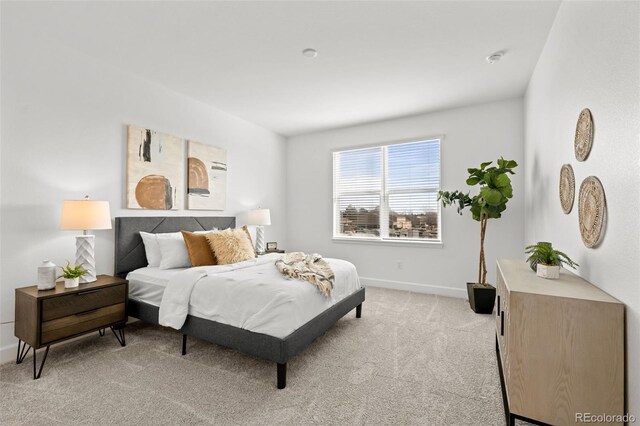 8242 S Pierson St, Littleton, CO 80127 - bedroom with light colored carpet and baseboards