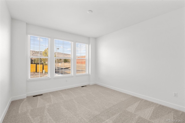8242 S Pierson St, Littleton, CO 80127 - carpeted empty room featuring visible vents and baseboards