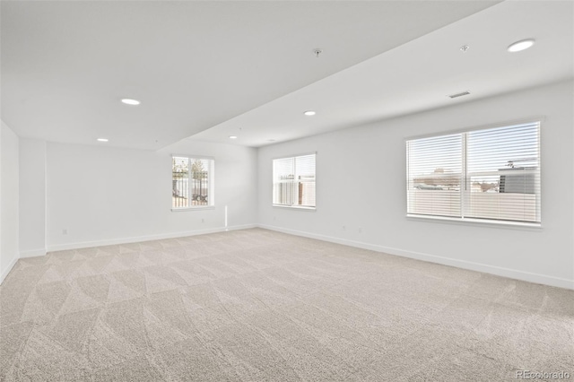 8242 S Pierson St, Littleton, CO 80127 - spare room with baseboards, light carpet, and visible vents