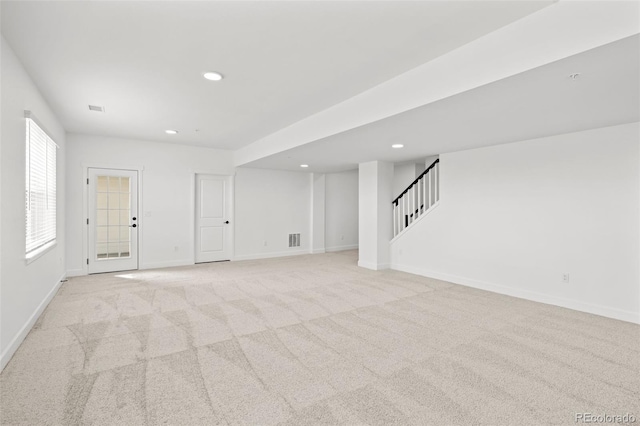 8242 S Pierson St, Littleton, CO 80127 - basement featuring stairway, baseboards, visible vents, light carpet, and recessed lighting