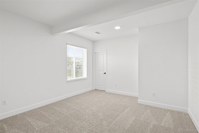 8242 S Pierson St, Littleton, CO 80127 - spare room featuring light colored carpet, visible vents, and baseboards