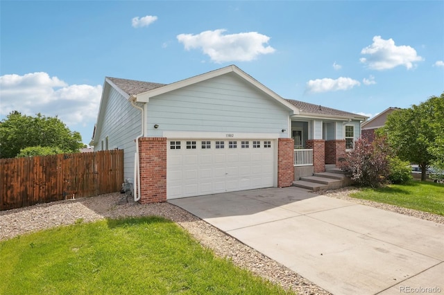 13802 Jasmine St, Thornton, CO 80602 - single story home with an attached garage, brick siding, and concrete driveway
