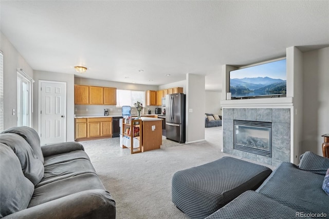 13802 Jasmine St, Thornton, CO 80602 - living room with light carpet and a fireplace