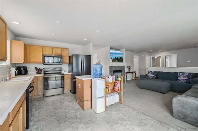 13802 Jasmine St, Thornton, CO 80602 - kitchen featuring stainless steel electric range oven, black microwave, freestanding refrigerator, dishwasher, and open floor plan