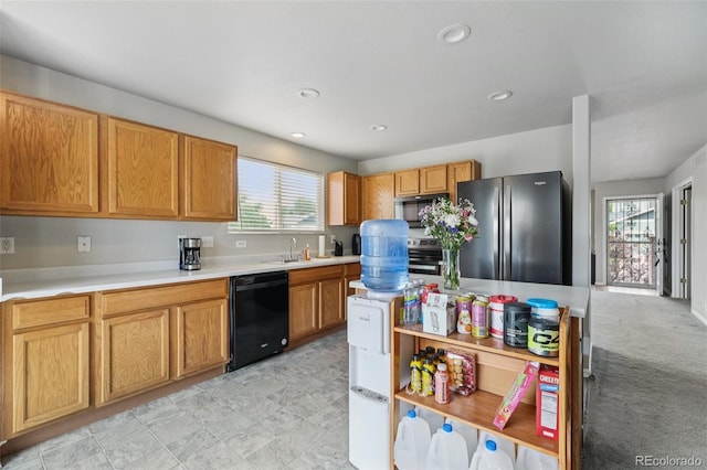 13802 Jasmine St, Thornton, CO 80602 - kitchen with freestanding refrigerator, black dishwasher, stainless steel microwave, wall oven, and light countertops