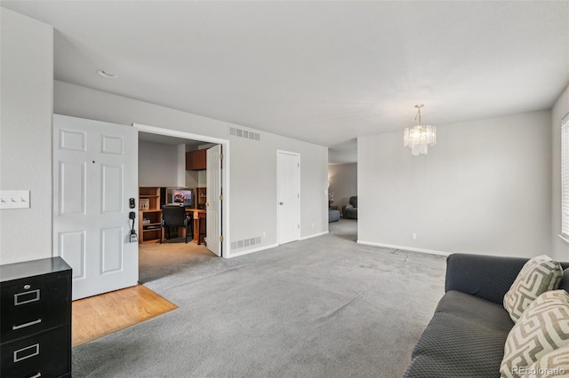 13802 Jasmine St, Thornton, CO 80602 - living room with a desk, a chandelier, and carpet