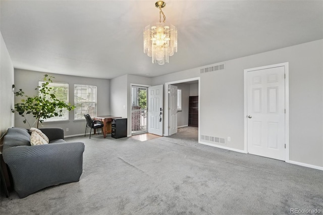 13802 Jasmine St, Thornton, CO 80602 - carpeted living area with baseboards and a chandelier