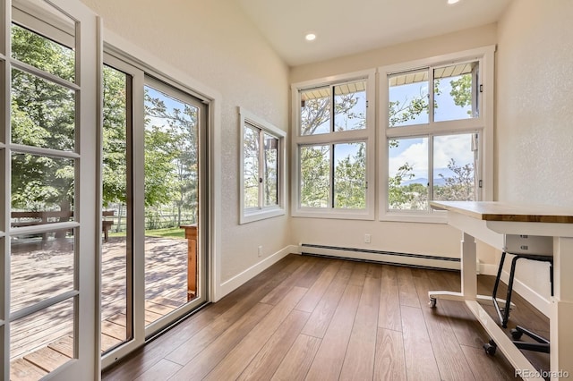 12196 W Belleview Dr, Littleton, CO 80127 - unfurnished sunroom with a baseboard radiator, a textured wall, healthy amount of natural light, wood-type flooring, and recessed lighting
