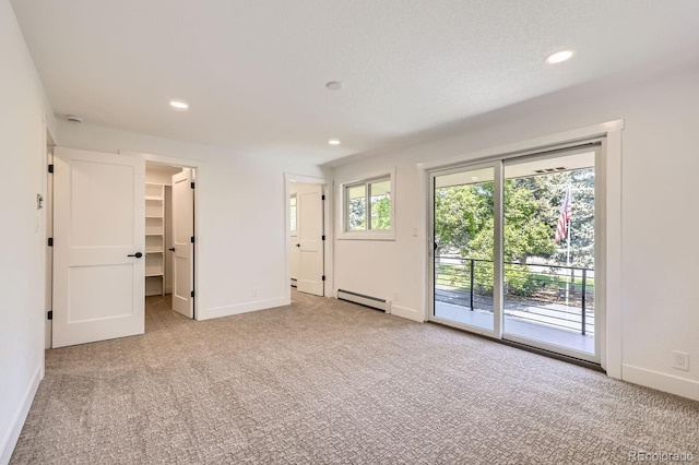 12196 W Belleview Dr, Littleton, CO 80127 - carpeted spare room with a baseboard radiator, recessed lighting, and baseboards