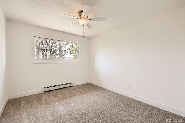 12196 W Belleview Dr, Littleton, CO 80127 - spare room with a baseboard heating unit, carpet floors, a ceiling fan, and baseboards