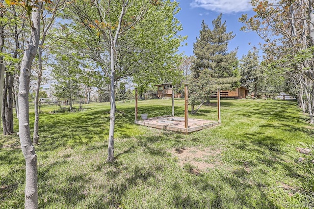 12196 W Belleview Dr, Littleton, CO 80127 - view of grassy yard with a wooden deck