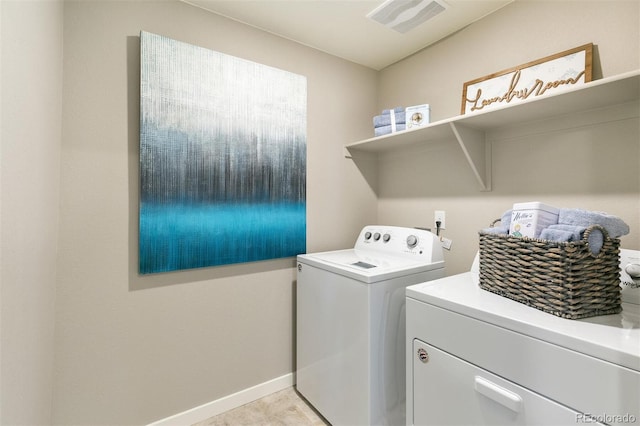 clothes washing area featuring washing machine and dryer