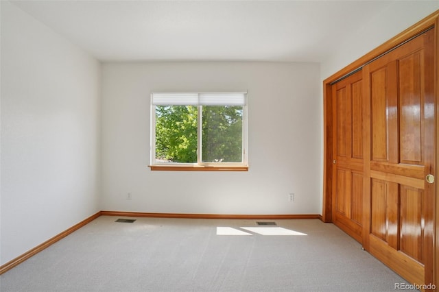 2247 Eagles Nest Dr, Lafayette, CO 80026 - unfurnished bedroom featuring light carpet and a closet