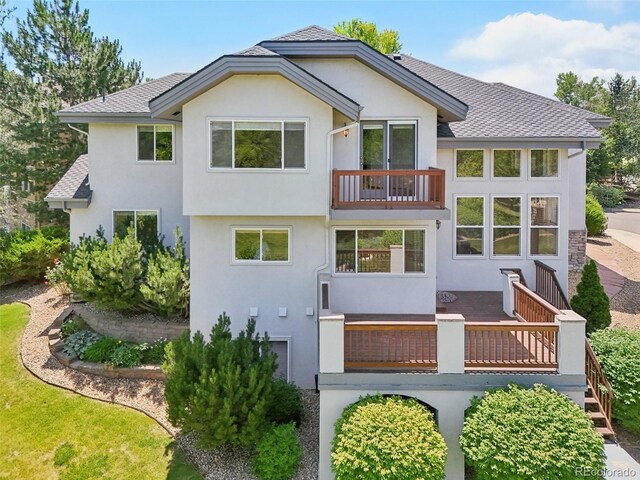 2247 Eagles Nest Dr, Lafayette, CO 80026 - rear view of property featuring stucco siding, a balcony, a deck, and roof with shingles