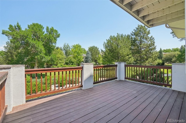 2247 Eagles Nest Dr, Lafayette, CO 80026 - wooden deck with view of wooded area