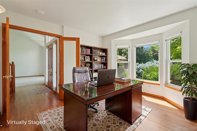 2247 Eagles Nest Dr, Lafayette, CO 80026 - office area featuring plenty of natural light and light wood finished floors