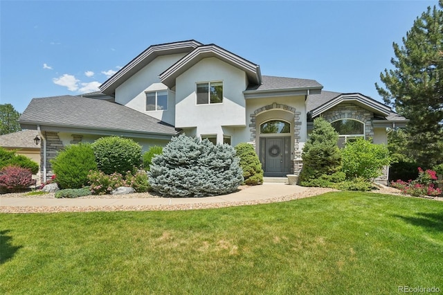 2247 Eagles Nest Dr, Lafayette, CO 80026 - view of front of property featuring a front lawn, stucco siding, and stone siding