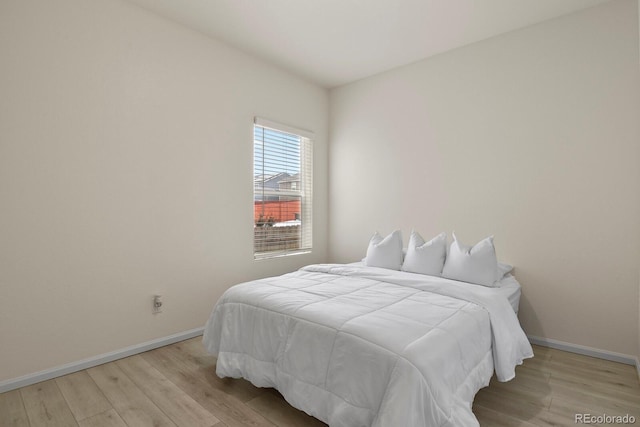 bedroom with light wood-type flooring