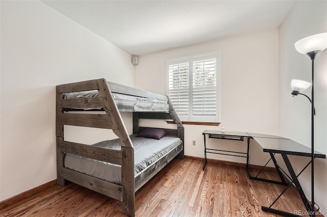 bedroom with wood-type flooring