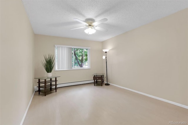 3022 S Wheeling Way Unit 107, Aurora, CO 80014 - spare room featuring baseboard heating, a ceiling fan, and a textured ceiling