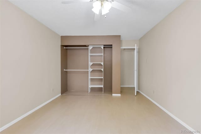 3022 S Wheeling Way Unit 107, Aurora, CO 80014 - unfurnished bedroom featuring baseboards and ceiling fan