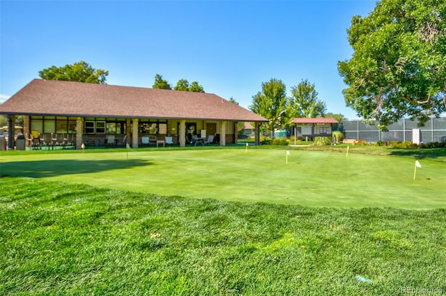 3022 S Wheeling Way Unit 107, Aurora, CO 80014 - view of community featuring a putting area and a lawn