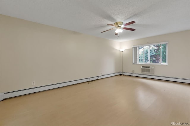3022 S Wheeling Way Unit 107, Aurora, CO 80014 - spare room with ceiling fan, a wall mounted air conditioner, a textured ceiling, and light wood finished floors