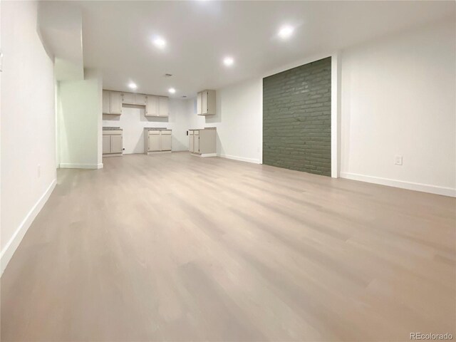 unfurnished living room with hardwood / wood-style flooring