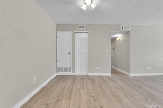 18034 E Ohio Ave Unit 104, Aurora, CO 80017 - spare room with light wood-style floors and ceiling fan