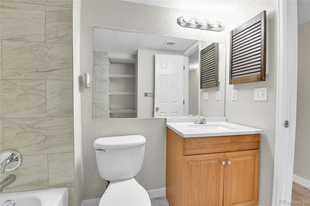 18034 E Ohio Ave Unit 104, Aurora, CO 80017 - full bathroom with vanity,  shower combination, and a textured wall