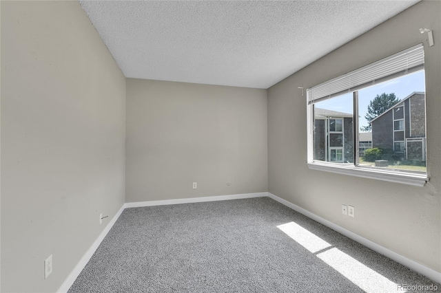 18034 E Ohio Ave Unit 104, Aurora, CO 80017 - carpeted spare room with a textured ceiling and baseboards