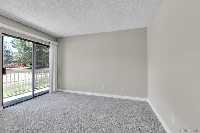18034 E Ohio Ave Unit 104, Aurora, CO 80017 - spare room featuring carpet and a textured ceiling