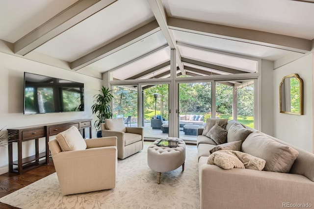 sunroom with vaulted ceiling with beams and a wealth of natural light