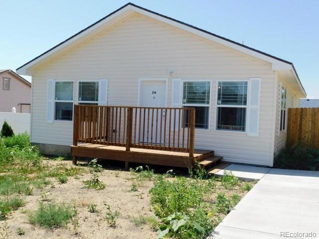 rear view of property featuring a deck