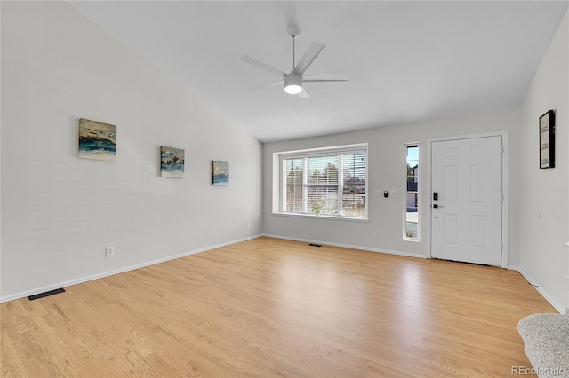 entryway with light wood-style flooring, baseboards, lofted ceiling, and a ceiling fan