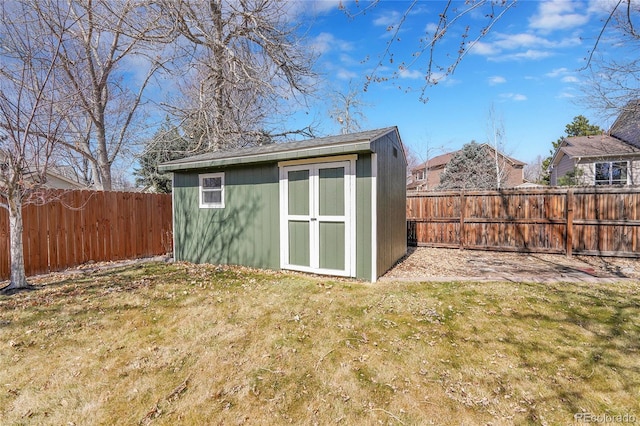 view of shed featuring a fenced backyard