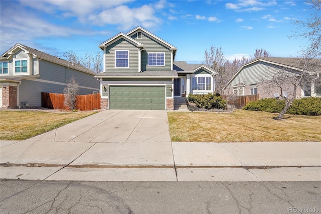 view of front of home featuring stone siding, fence, concrete driveway, a front yard, and an attached garage