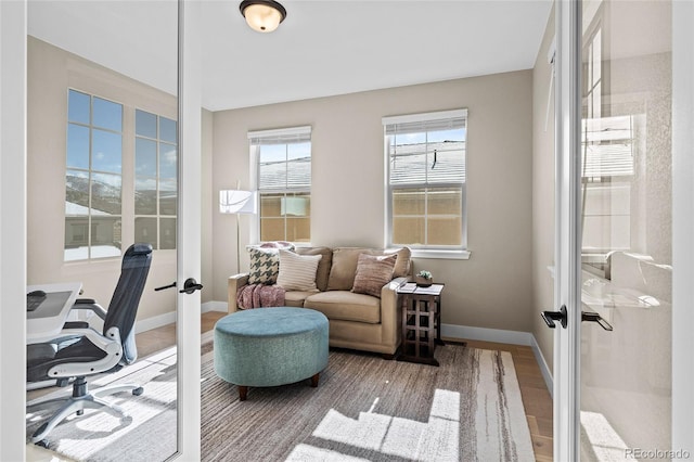 home office with french doors and wood-type flooring