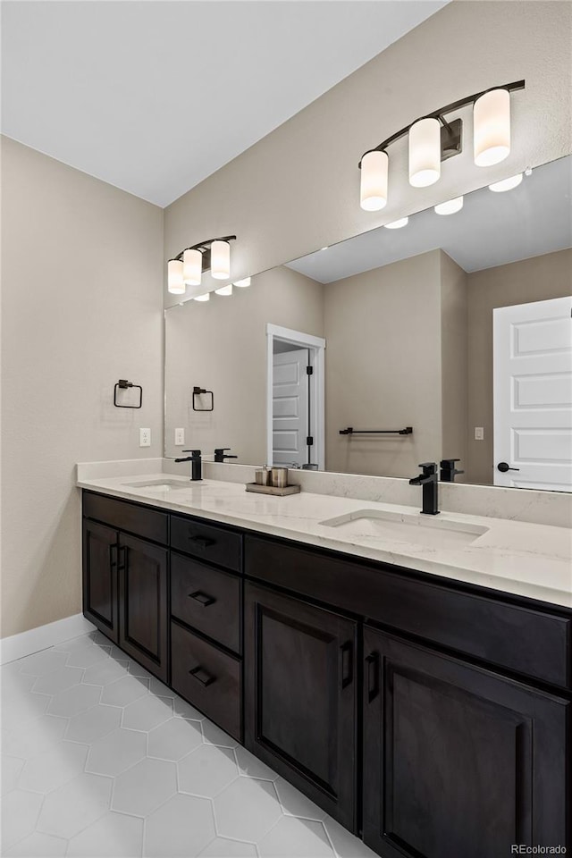 bathroom featuring tile patterned flooring and vanity