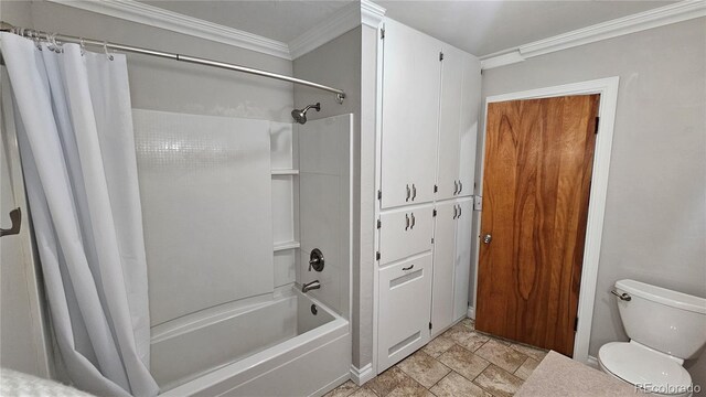 315 W 5th St, Julesburg, CO 80737 - full bath with ornamental molding, toilet, and shower / bath combo with shower curtain
