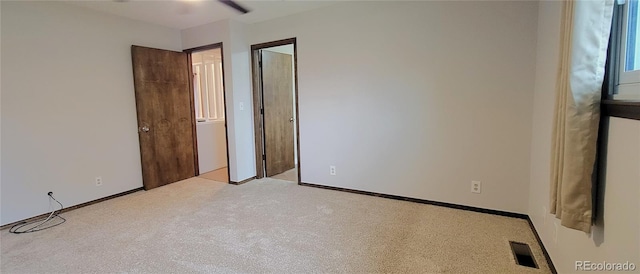 315 W 5th St, Julesburg, CO 80737 - unfurnished bedroom featuring carpet flooring, baseboards, and visible vents