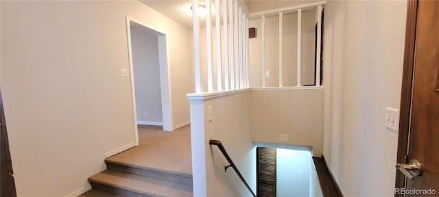 315 W 5th St, Julesburg, CO 80737 - staircase with carpet floors, baseboards, and a textured ceiling
