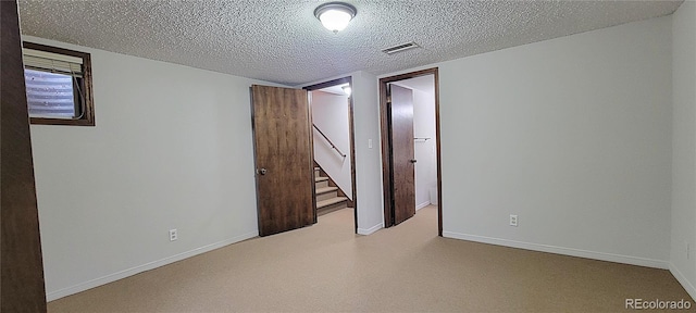 315 W 5th St, Julesburg, CO 80737 - interior space with a textured ceiling, baseboards, and visible vents