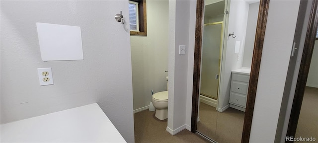 315 W 5th St, Julesburg, CO 80737 - bathroom featuring toilet, a stall shower, and baseboards