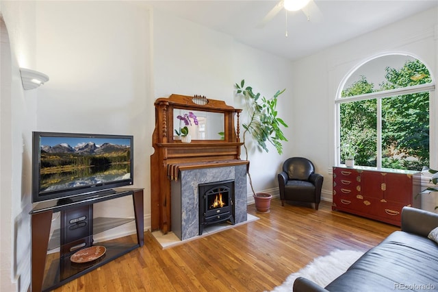 living room with ceiling fan and light hardwood / wood-style floors