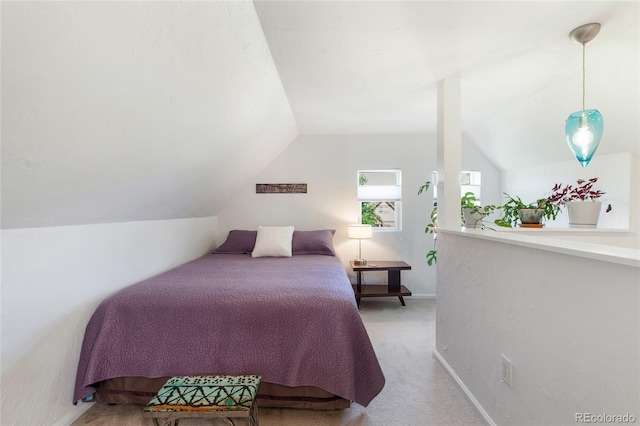 bedroom featuring light carpet and vaulted ceiling