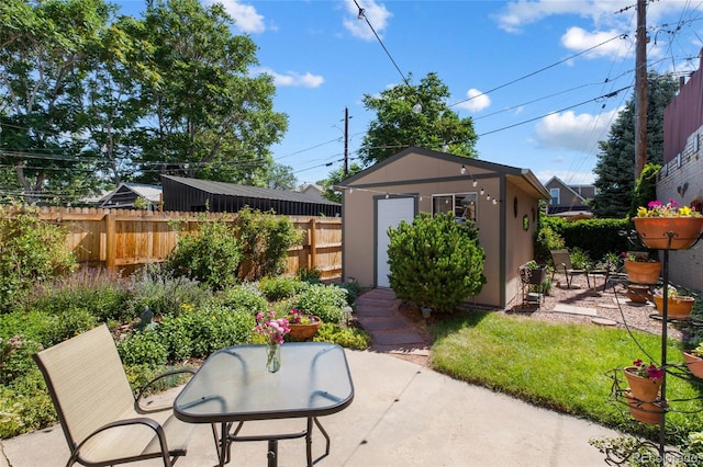 view of patio featuring a shed